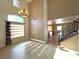 Bright dining area with high ceilings, tile floors, and a chandelier at 5945 Moon Garden St, Las Vegas, NV 89148