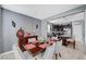 Bright dining room with a wood table and gray chairs at 7485 Earnshaw Ave, Las Vegas, NV 89179