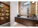 Modern powder room with floating vanity and unique wall decor at 1006 Mystic Rim Dr, Henderson, NV 89012