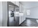 Stainless steel refrigerator and modern gray cabinets in a spacious kitchen at 230 Palisade Falls Ave, Henderson, NV 89015