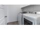 Laundry room with washer and dryer and shelving at 230 Palisade Falls Ave, Henderson, NV 89015