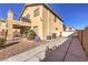 Backyard with covered patio, gravel landscaping, and two-story home at 3105 Madame Plantier Ave, North Las Vegas, NV 89081