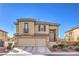 Two-story house with beige walls, brown roof, and a two-car garage at 3105 Madame Plantier Ave, North Las Vegas, NV 89081