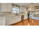 Modern kitchen with white cabinets, marble countertops, and stainless steel appliances at 3618 Storrie Ct, Las Vegas, NV 89103