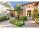 Charming courtyard entry with fountain and landscaping at 3754 Aldenham Dr, Las Vegas, NV 89141