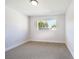 Simple bedroom with carpeted floor and a single window at 4450 San Rafael Ave, Las Vegas, NV 89120