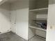 Garage storage area with shelving and door at 5070 Tara Ave # 119, Las Vegas, NV 89146