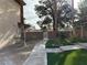 Sidewalk leads to gated entry with artificial turf and landscaping at 5070 Tara Ave # 119, Las Vegas, NV 89146