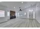 Bright living room with fireplace, vaulted ceiling, and wood-look floors at 7413 Turtle Dove Ct, Las Vegas, NV 89129