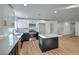 Modern kitchen with island, white and dark cabinets, and quartz countertops at 835 Cherry Dr, Henderson, NV 89002