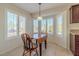 Cozy breakfast nook with a drop-leaf table and window seating at 8908 Marble Dr, Las Vegas, NV 89134