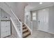 Bright entryway with staircase, tile flooring, and white door at 924 Monte Nerone Ave, Henderson, NV 89012