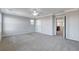 Main bedroom with ceiling fan, carpet, and access to loft area at 924 Monte Nerone Ave, Henderson, NV 89012