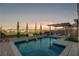 Relaxing pool and spa area with a pergola and lush landscaping at 924 Monte Nerone Ave, Henderson, NV 89012