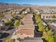 Aerial view of a residential neighborhood with houses and landscaping at 9532 Parker Springs Ct, Las Vegas, NV 89166