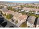 Aerial view of house with driveway and neighborhood in background at 9532 Parker Springs Ct, Las Vegas, NV 89166