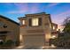 Two-story house with a tan exterior, brown roof, and attached garage at 9532 Parker Springs Ct, Las Vegas, NV 89166