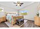 Main bedroom with wood flooring and large window at 9532 Parker Springs Ct, Las Vegas, NV 89166