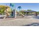 Community playground with play structures and shaded seating at 1018 Maple Pines Ave, North Las Vegas, NV 89081