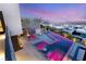 Elevated view of a modern pink-lit pool and spa area at 12 Falling Canyon Ct, Henderson, NV 89011