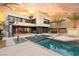 Stunning backyard with a modern pool, spa, and spiral staircase at 12 Falling Canyon Ct, Henderson, NV 89011