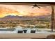 Luxury pool with mountain views at sunset at 12 Falling Canyon Ct, Henderson, NV 89011