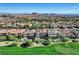 Community overview with houses and a golf course at 1987 Orchard Mist St, Las Vegas, NV 89135