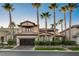 Beautiful two-story house with palm trees and a modern garage at 1987 Orchard Mist St, Las Vegas, NV 89135