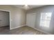 Spacious bedroom with vinyl plank flooring and access to a hallway at 1990 S Manzanita Dr, Pahrump, NV 89048