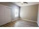 Bright bedroom with double door closet and vinyl plank flooring at 1990 S Manzanita Dr, Pahrump, NV 89048