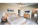 Bedroom with ensuite bathroom and ceiling fan at 1990 S Manzanita Dr, Pahrump, NV 89048