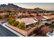 Aerial view of home with backyard patio and mountain views at 2124 Sierra Heights Dr, Las Vegas, NV 89134