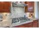 Modern kitchen with gas cooktop and stylish diamond-pattern backsplash at 2124 Sierra Heights Dr, Las Vegas, NV 89134