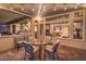 Covered patio with dining table and view into the kitchen at 2124 Sierra Heights Dr, Las Vegas, NV 89134