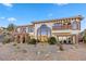 Stunning Spanish-style home with a large balcony and desert landscaping at 220 Hallett Cove Ct, Boulder City, NV 89005