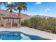 Brick gazebo with mountain backdrop, perfect for outdoor entertaining at 220 Hallett Cove Ct, Boulder City, NV 89005