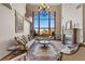 Elegant living room with ornate furniture, fireplace and large windows with a view at 220 Hallett Cove Ct, Boulder City, NV 89005