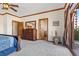 Main bedroom with king bed, dresser, and access to a private patio at 220 Hallett Cove Ct, Boulder City, NV 89005