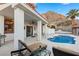 Enjoy the refreshing pool and spacious patio with comfortable seating at 220 Hallett Cove Ct, Boulder City, NV 89005