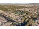 Aerial view of homes and tennis courts in a residential community at 28 Tea Olive Dr, Las Vegas, NV 89141