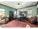 Home office with built-in bookcases and leather armchairs at 28 Tea Olive Dr, Las Vegas, NV 89141