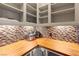 Large pantry with wood shelving and tile backsplash at 28 Tea Olive Dr, Las Vegas, NV 89141