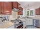 Modern kitchen with stainless steel appliances and custom cabinetry at 326 Caneflower Ct, North Las Vegas, NV 89031