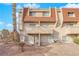 Two story stucco building with tile roof, and stairs leading to entrance at 3555 Arville St # 105C, Las Vegas, NV 89103