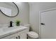 Modern bathroom with white vanity, quartz countertop, and black fixtures at 4327 Bassae Temple Ave, North Las Vegas, NV 89031