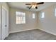 Bright bedroom featuring a ceiling fan and ample natural light at 4327 Bassae Temple Ave, North Las Vegas, NV 89031