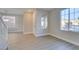 Bright living room with hardwood floors and large windows at 4327 Bassae Temple Ave, North Las Vegas, NV 89031