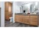 Bathroom with single vanity, toilet, and grey tile floor at 440 Probst, Las Vegas, NV 89110