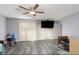 Bedroom with sliding door, ceiling fan, and grey tile floor at 440 Probst, Las Vegas, NV 89110