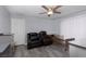 Bedroom with two recliners, ceiling fan, and grey tile floor at 440 Probst, Las Vegas, NV 89110